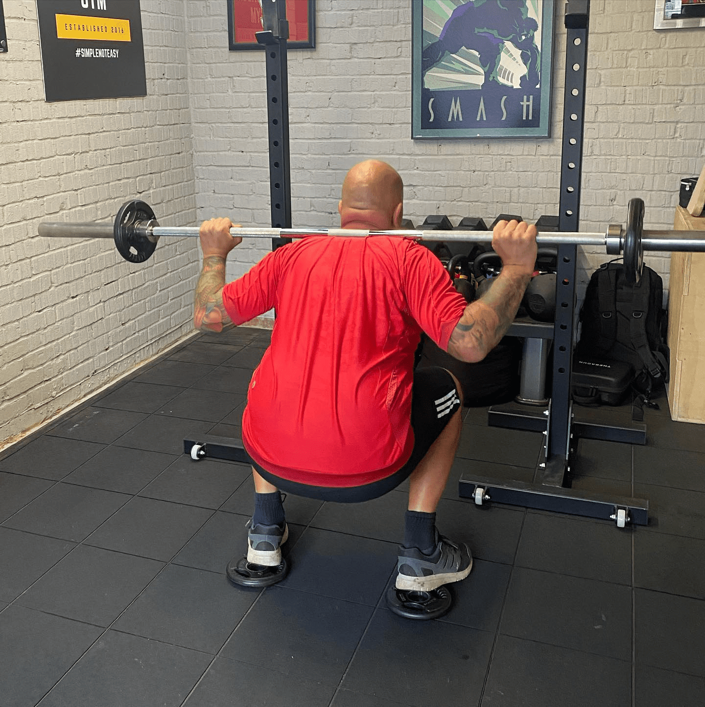 standing on plate for squats